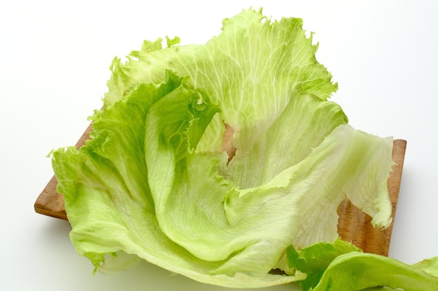 Fresh organic green iceberg lettuce on white background Close up and selective focus