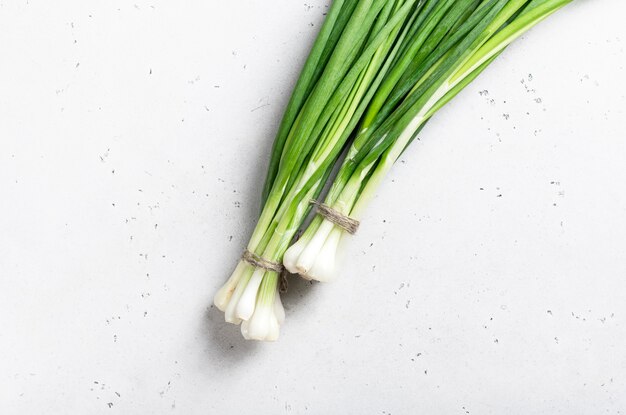 Fresh organic green onions isolated on white