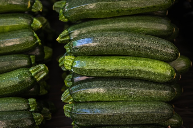 Fresh organic green zucchini on a fresh market.