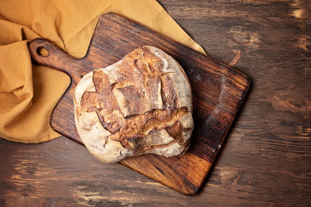 Fresh organic homemade bread. Healthy eating, buy local, bread recipes concept. Top view, flat lay