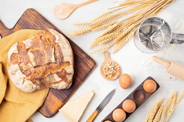 Fresh organic homemade bread. Healthy eating, home cooking, buy local, bread recipes concept. Top view, flat lay