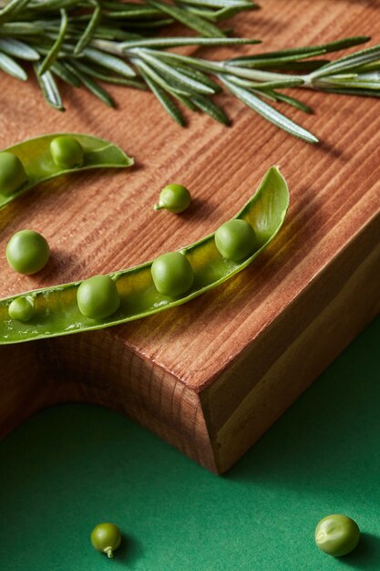 Fresh organic ingredients for preparing healthy vegetarian raw dieting food on a wooden board on a green. Detox dieting concept.