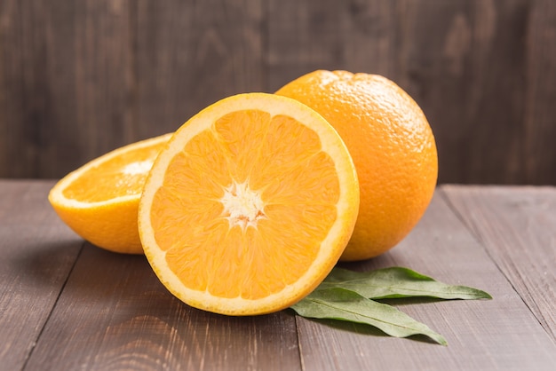 Fresh organic oranges fruits on wooden table