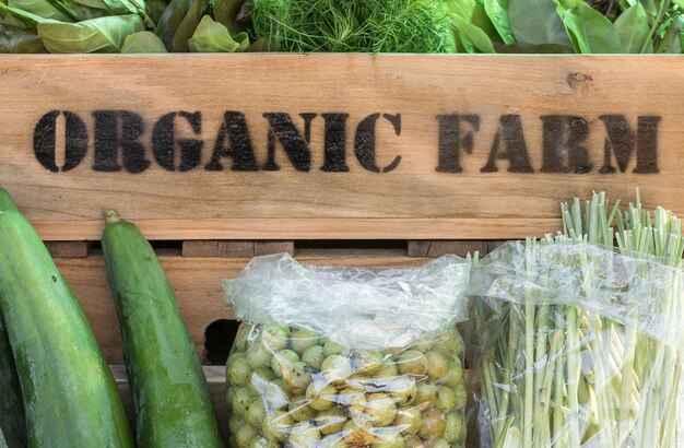 Photo fresh organic produce in wooden box