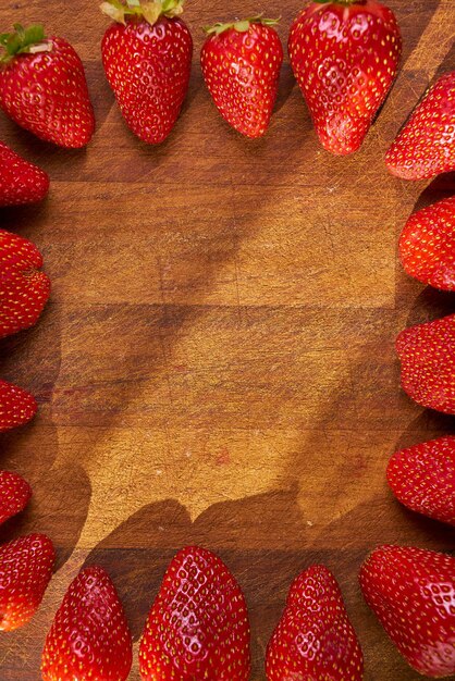 Fresh organic strawberries on a wooden cutting board Strawberry banner