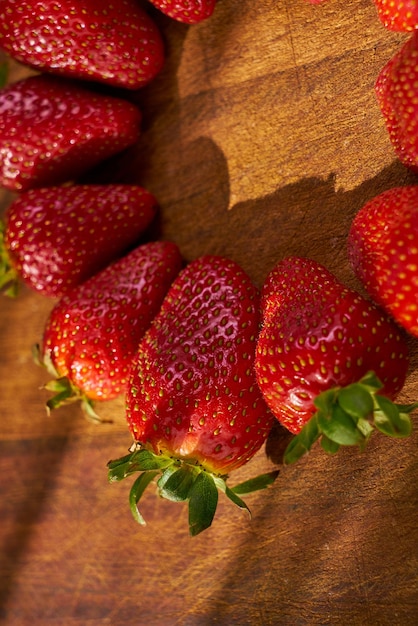 Fresh organic strawberries on a wooden cutting board Strawberry banner