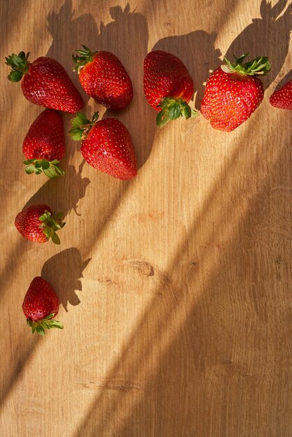 Fresh organic strawberries on a wooden cutting board Strawberry banner