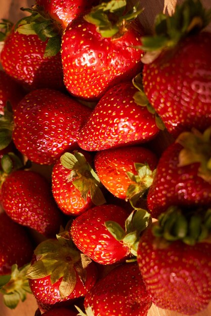 Fresh organic strawberries on a wooden cutting board Strawberry banner