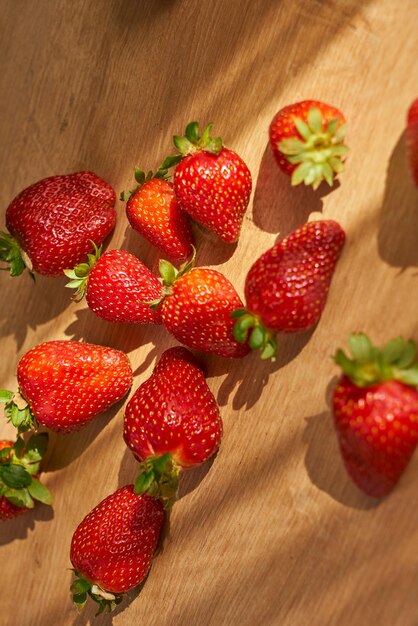 Fresh organic strawberries on a wooden surface