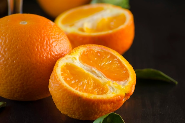 Fresh organic tangerines on a black background close-up