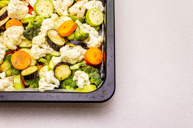 Fresh organic vegetables in baking tray