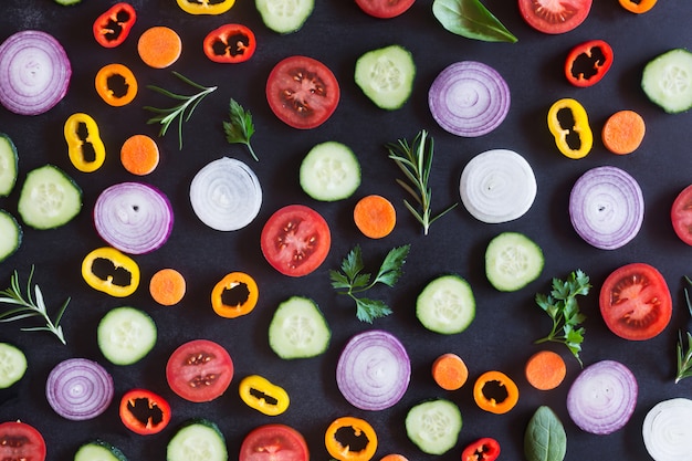 Photo fresh organic vegetables on a dark background. top view