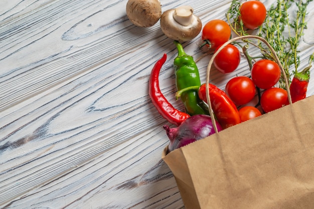 Fresh organic vegetables in eco friendly paper bag