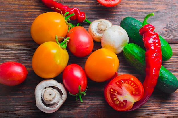 Fresh organic vegetables on an old wooden table