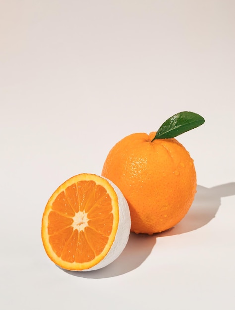 Fresh organic and white colored orange fruit on white background Minimal food concept