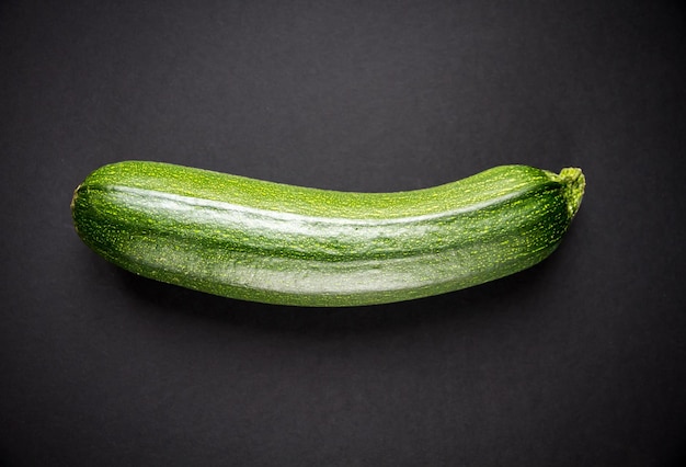 Fresh organic zucchini isolated on a black background