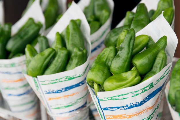 Fresh padron pepper in paper cone at farmers market