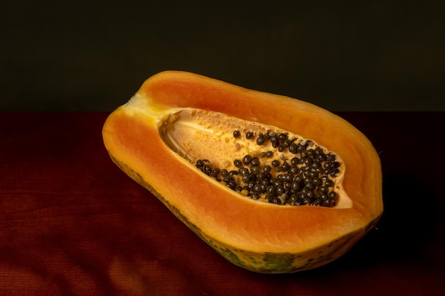 Fresh papaya fruit on dark background