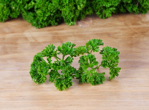 Fresh parsley on wood background