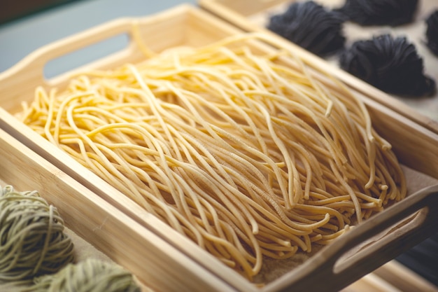 Fresh pasta. Handmade homemade Italian pasta made with fresh ingredients, eggs and wheat flour. High quality photo