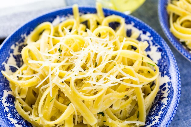 Fresh pasta pangrattato with crispy eggs on the table.