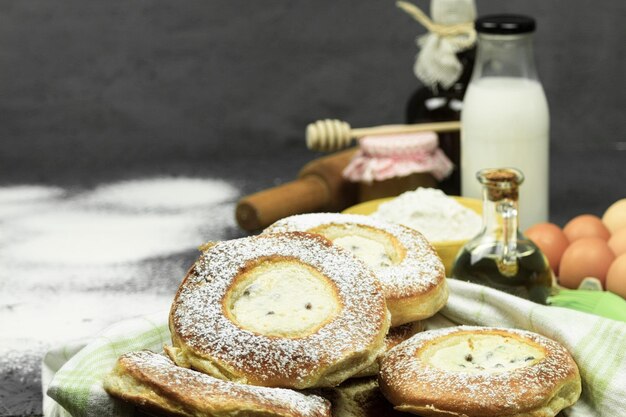 Fresh pastries on the background of ingredients for baking