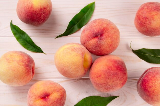 Fresh peaches on a wooden table