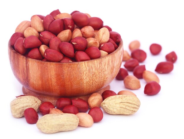 Fresh Peanuts in a bowl over white background