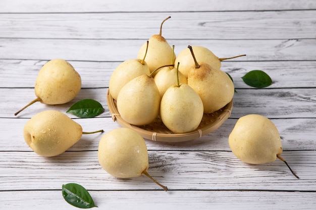 Fresh pear isolated above wooden table