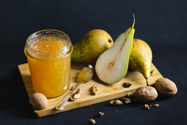 Fresh pear jam on the dark table