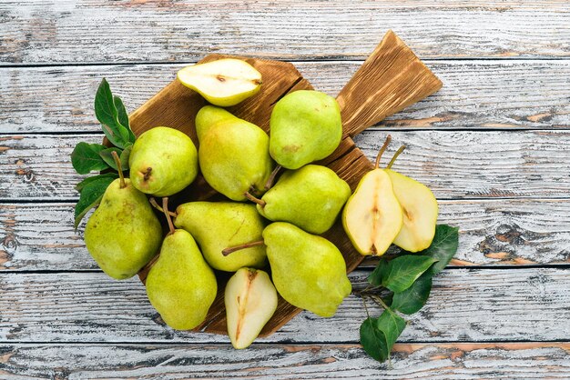 Fresh pears on a white wooden table Fruits Free space for text Top view