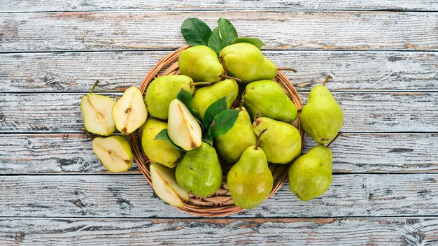 Fresh pears on a white wooden table Fruits Free space for text Top view