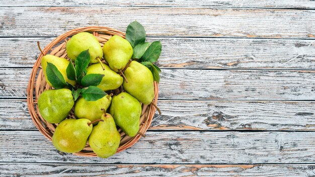 Fresh pears on a white wooden table Fruits Free space for text Top view