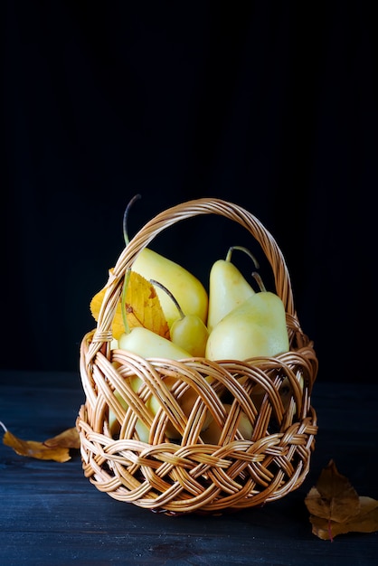 Fresh pears in a wicker basket