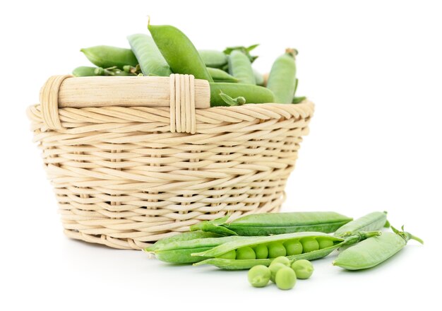 Fresh peas in basket on a white background.