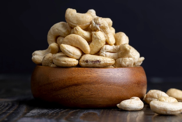 Fresh peeled cashew nuts on the table delicious cashew nuts on a wooden surface