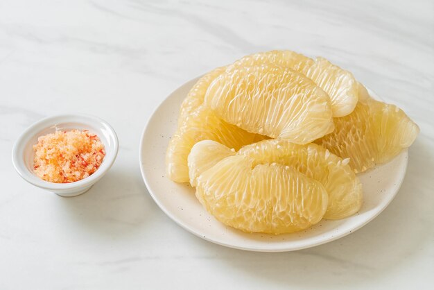 Fresh peeled pomelo grapefruit or shaddock