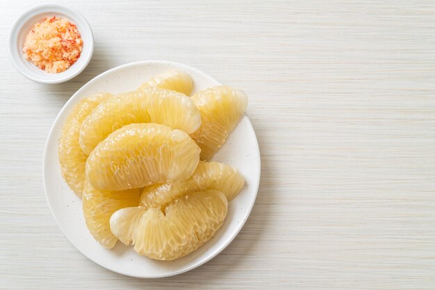 Fresh peeled pomelo grapefruit or shaddock