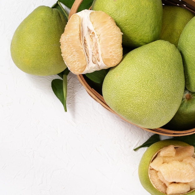 Fresh peeled pomelo on table