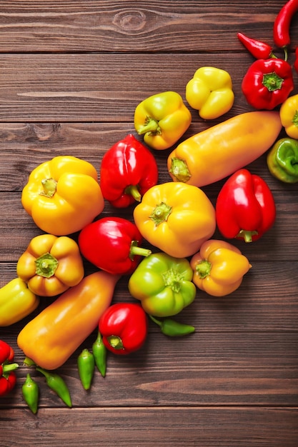 Fresh peppers on wooden table