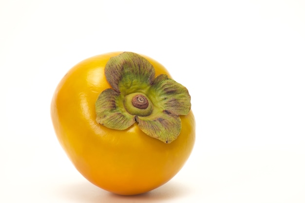 Fresh persimmon isolated on white surface