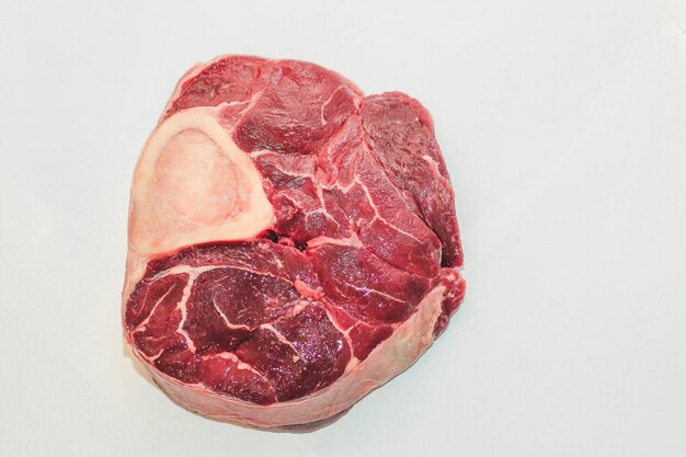Fresh piece of meat big beef steak on the bone ossobuco