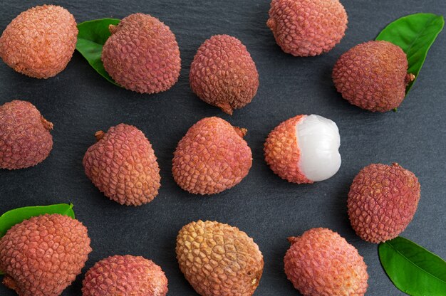 Fresh pile of lychees with leaves