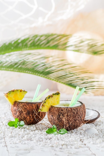 Fresh pinacolada in coconut in sunny day