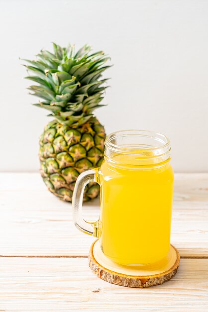 fresh pineapple juice on wood