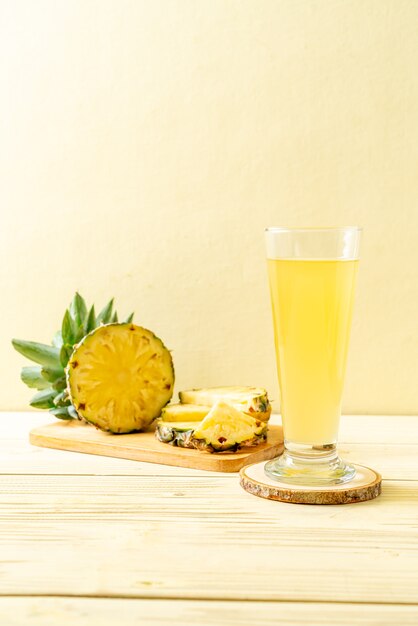 fresh pineapple juice on wood