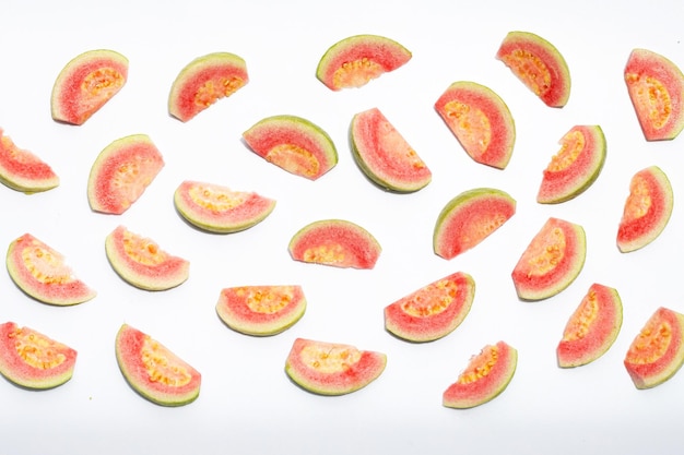 Fresh pink guava on white background