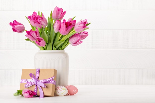 Fresh pink tulip flowers and easter eggs