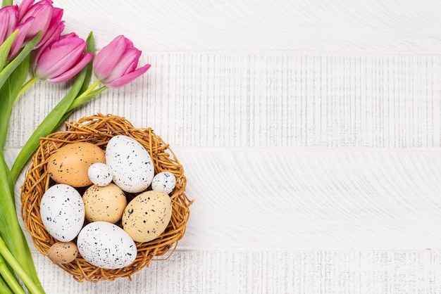 Fresh pink tulip flowers and easter eggs