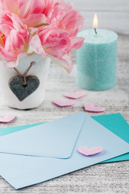 Fresh pink tulip flowers and envelopes